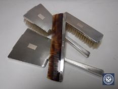 An Art Deco silver four piece dressing table set, Birmingham 1937.