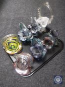 A tray of coloured glass baskets
