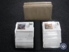 A box of two albums of Prince Charles & Lady Diana commemorative stamps,