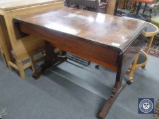 A continental flap sided table with under stretcher