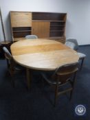 A 1970s seven piece teak dining room suite