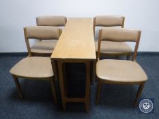 A late 20th century drop leaf table and four chairs
