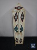 A painted double door audio cabinet and small quantity DVDs