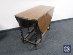 An oak barley twist gate leg table