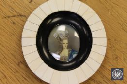 A portrait miniature depicting a lady wearing a bonnet with blue shawl, diameter 11.5 cm.