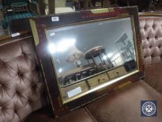 A framed Linz Pilkington mirror CONDITION REPORT: 81cm by 57cm.