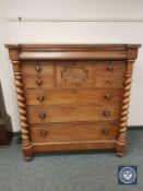 A Victorian mahogany eight drawer chest with barley twist supports,