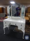 A painted dressing table with triple mirror