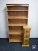 A set of pine open shelves and a narrow pine four drawer chest