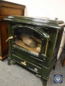 A Eurostove Harmony 1 cast iron enamelled green multi fuel stove,