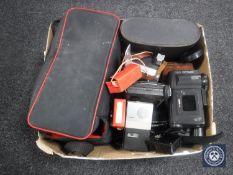 A box of assorted cameras, video camera,