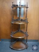 A Victorian style mahogany four-tier corner whatnot stand