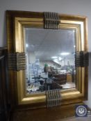 A gilt framed mirror