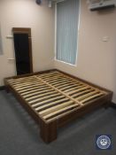 A Barker & Stonehouse walnut effect 5' bed frame with glass panelled headboard