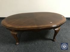 A contemporary oval coffee table