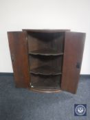 A 19th century oak double door corner cabinet