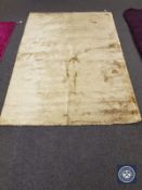 A contemporary shaggy pile rug on cream ground,