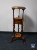A mahogany wig stand fitted two drawers