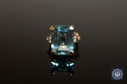 An 18ct gold topaz and diamond ring,