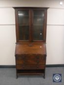 An Edwardian oak bureau bookcase