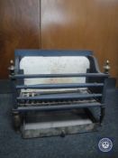 A cast iron fire grate with tray