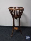 A Victorian inlaid mahogany plant stand