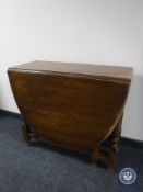 An oak gateleg table