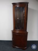 A mahogany corner display cabinet