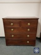 A George III mahogany chest of five drawers,