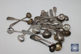 A collection of twenty-four Georgian and later silver salt and mustard spoons