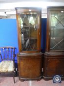A mahogany corner cabinet