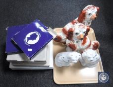 A tray of two pairs of Staffordshire dogs and four boxed Royal Copenhagen plates