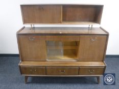 A mid 20th century teak sideboard