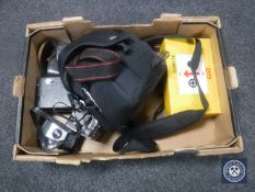 A box of vintage cameras