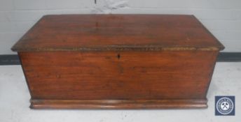 A stained pine blanket box