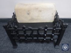 A cast iron gas fire grate and rocks
