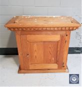 A pine wall cupboard