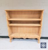 A blond oak open bookcase