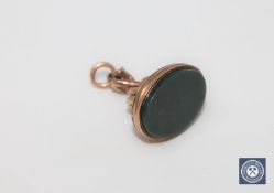 An antique gold agate fob, the top in the form of a snake.