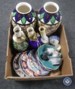 Two boxes of Eastern wall masks, pottery table lamps,