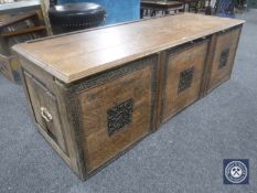 A carved oak blanket box