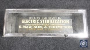 A glazed steel wall cabinet,