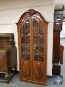 A glazed mahogany domed topped bookcase, width 80 cm.