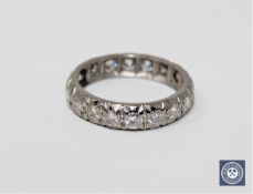 A diamond full eternity ring in white metal, approximately 1ct.