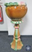 An English pottery jardiniere on stand,