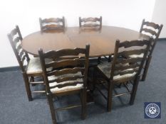 A circular oak pedestal dining table with leaf together with a set of six tapestry seated ladder