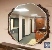 A good quality oak framed bevelled wall mirror, probably Lees, width 81 cm.