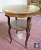 A mahogany two tier occasional table