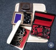 Four boxes of costume beads,