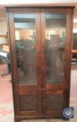 A contemporary hardwood glazed display cabinet